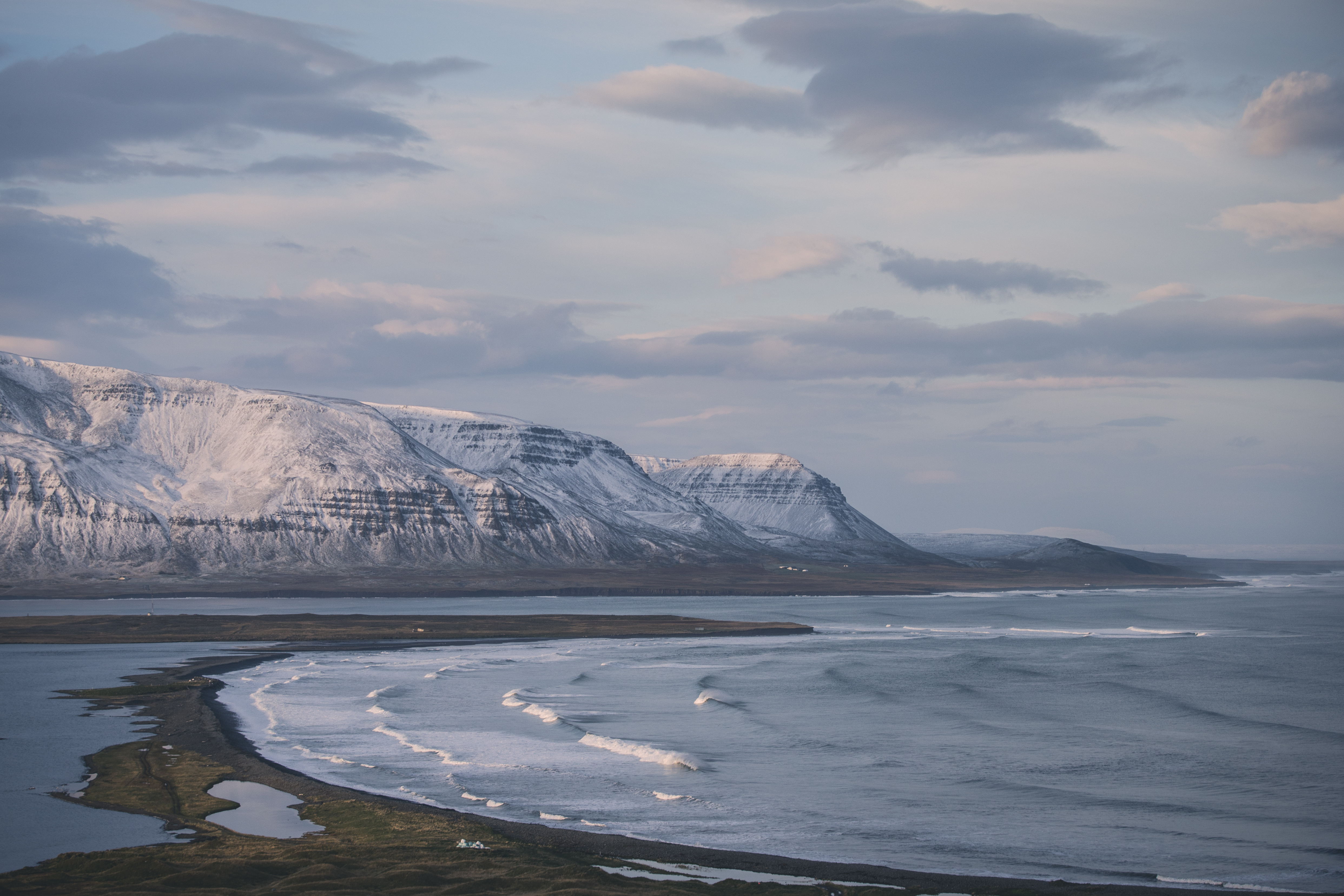 Sweeping view of Westfjords coast with snow-capped cliffs