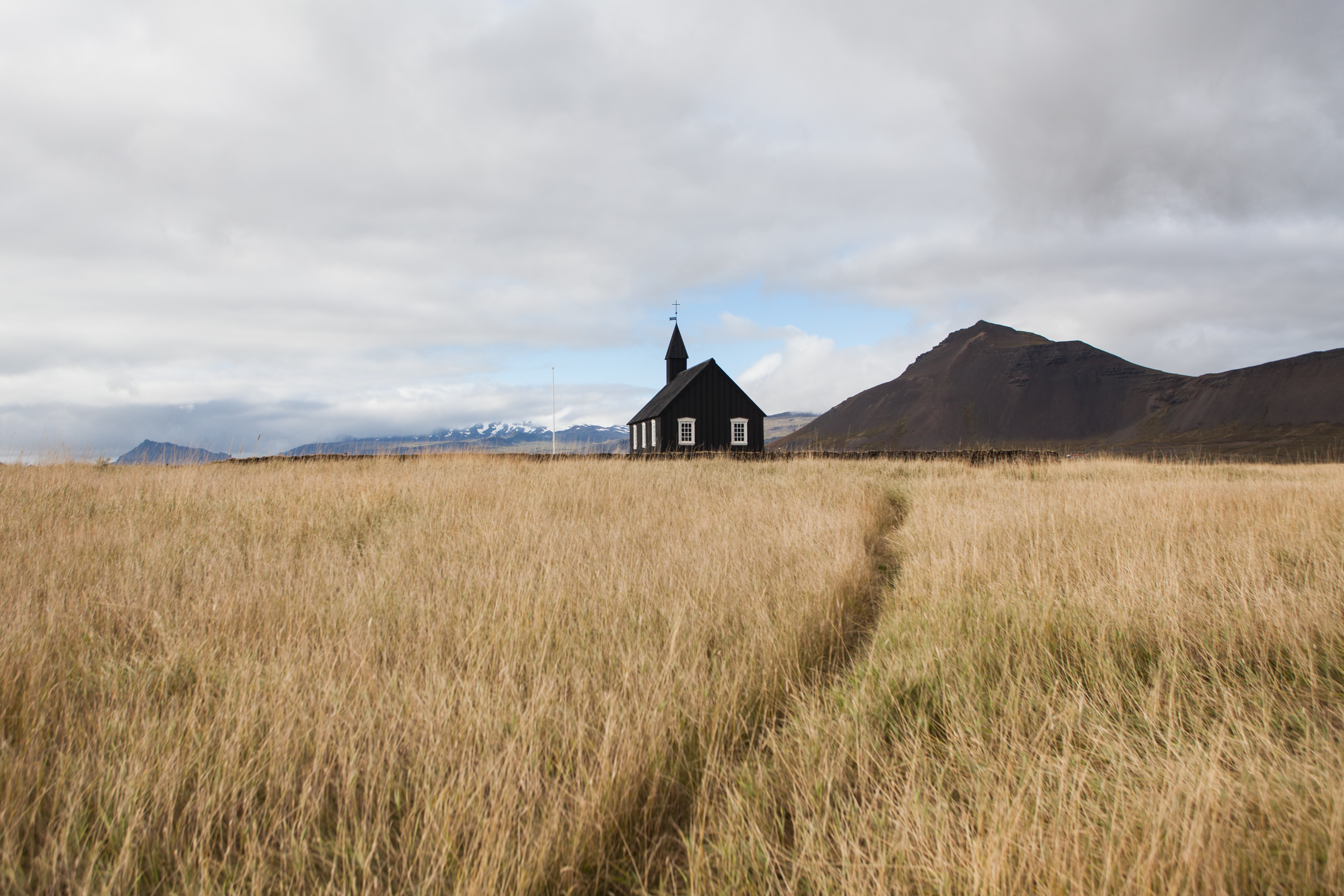 Iconic black church in a field of golden grass